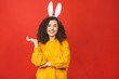 © denis_vermenko - Young caucasian woman wearing cute easter rabbit ears over red isolated background while smiling confident and happy.