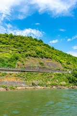 Wall Mural - Germany, Rhine Romantic Cruise, a large body of water with a mountain in the background