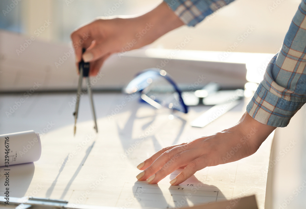 Female architect working in office