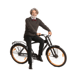 Wall Mural - Stylish elderly man with bicycle on white background