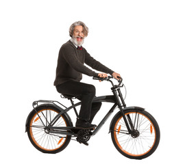 Wall Mural - Happy elderly man with bicycle on white background