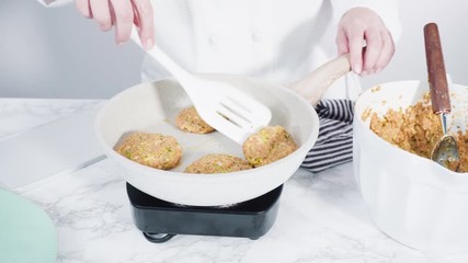 Sticker - Step by step. Frying zucchini cakes in olive oil on a small frying pan.