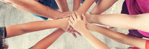 Fotografía group of people joining hands, success in teamwork