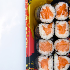 Wall Mural - Sushi Roll with salmon on the white background .Food abstract background