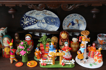 Russian traditional national handicrafts: vintage dymkovo clay toys, nested dolls, matryoshka, filimonovsky toys, ware Gzhel. Folk art, ethnic craft. Russian souvenirs