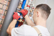 © Kadmy - plumber installing water equipment - meter, filter and pressure reducer
