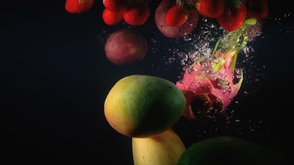 Wall Mural - Video of falling exotic fruits in the water