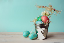 Easter Background. Easter Eggs In Bucket With Decor. Happy Easter Concept. Eggs And Rabbit