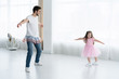 © opolja - I love you, dad! Handsome young man is dancing at home with his little girl. Happy Father's Day!