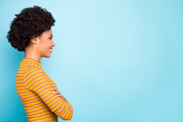 Poster - Profile photo of beautiful business dark skin wavy lady arms crossed look empty space listen colleagues report wear casual striped pullover isolated blue color background