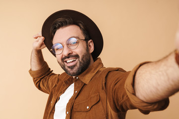 Poster - Cheery young unshaved man in hat