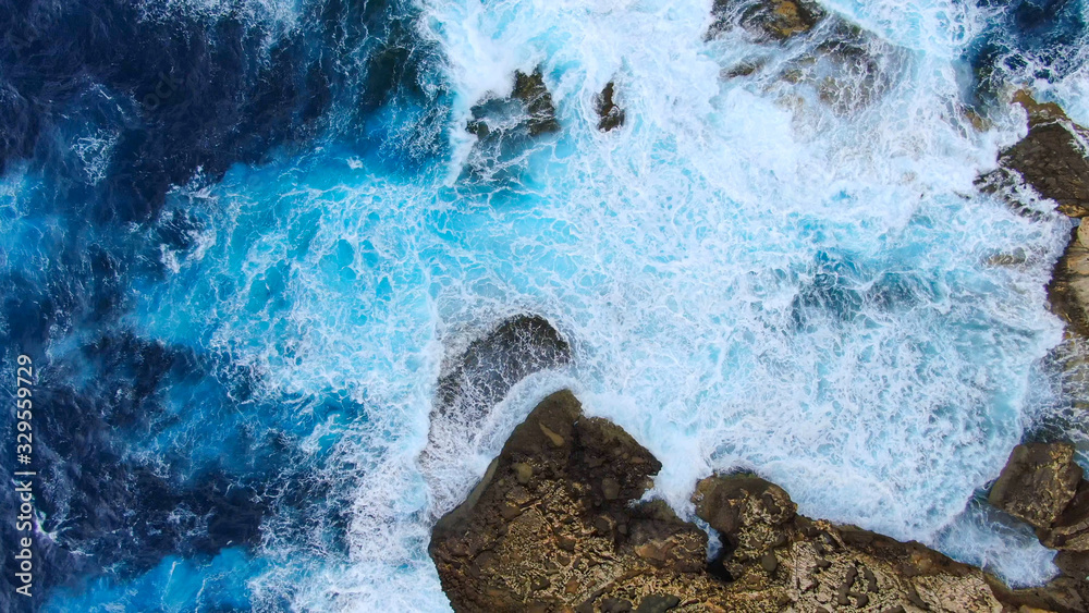 Wild Ocean water from above - Waves hitting the rocks - aerial photography - obrazy, fototapety, plakaty 