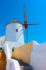 Poster - Old whitewashed windmill in Santorini