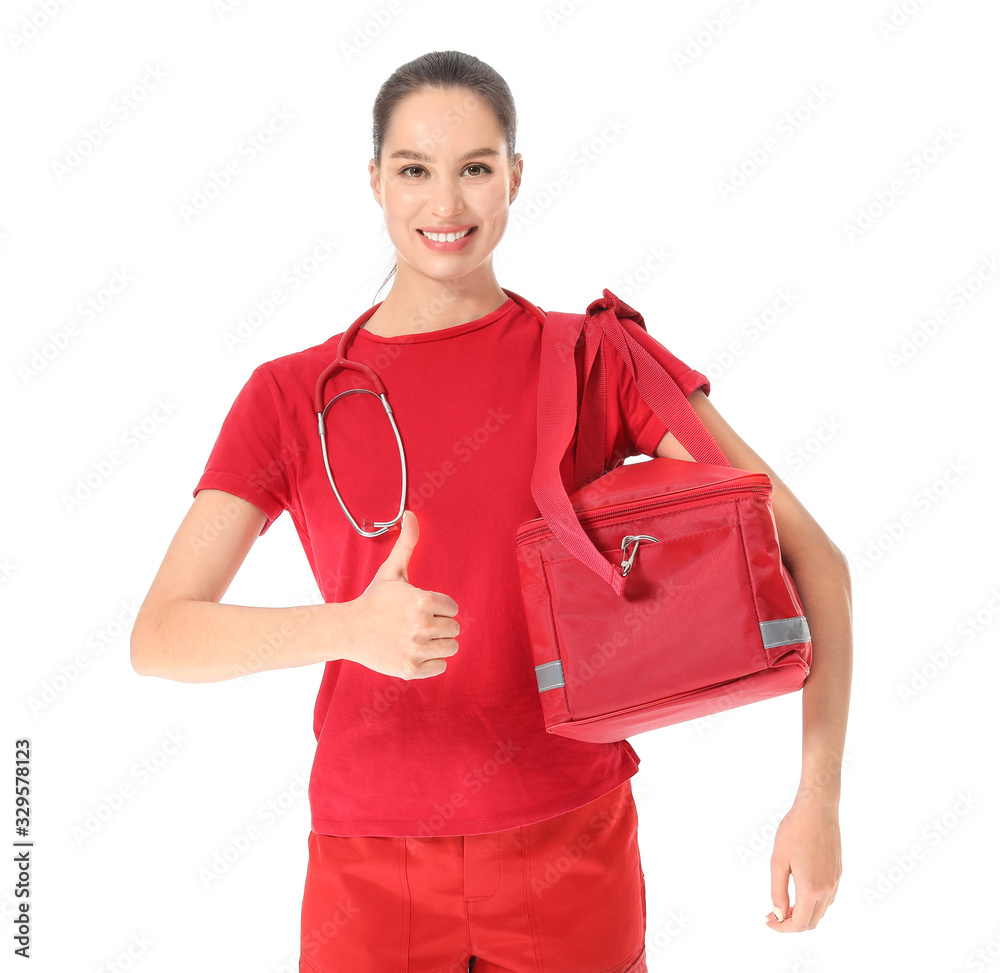 Female paramedic with bag showing thumb-up gesture on white background