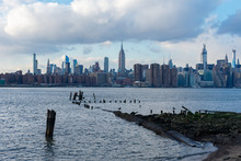 Midtown Manhattan Skyline In New York City Seen From The Shore Of Williamsburg Brooklyn New York