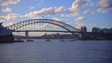 Time Lapse Of Sydney Harbour On A Summer Afternoon At Sunset Blue Skies With Orange White Clouds And Boats In The Harbour