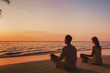 © Song_about_summer - meditation and relaxation for couple, yoga group on the beach at sunset
