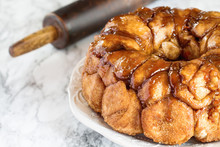 Easter Dessert Of Pull Apart Carrot Cake Monkey Bread. A Yeast Bundt Cake Made With Cinnamon, Carrots, Nuts And A Brown Sugar Glaze. Selective Focus With Blurred Foreground And Background.