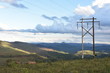 Electric power pole with mountains in the background