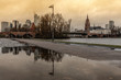 Frankfurt skyline reflection in a rain puddle