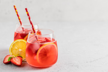 Wall Mural - Summer iced strawberry lemon infused water cocktail. Selective focus, space for text.