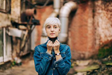 casual portrait of beautifu blond young woman outdoors