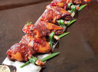  Grilled baked chicken wings with hot chili pepper and soy sauce.