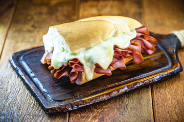 Wall Mural - mortadella sandwich, made with a great Italian mortadella sausage, a sandwich popular in Brazil, especially in São Paulo. The sandwich is made with half a pound of sausage and cheese.