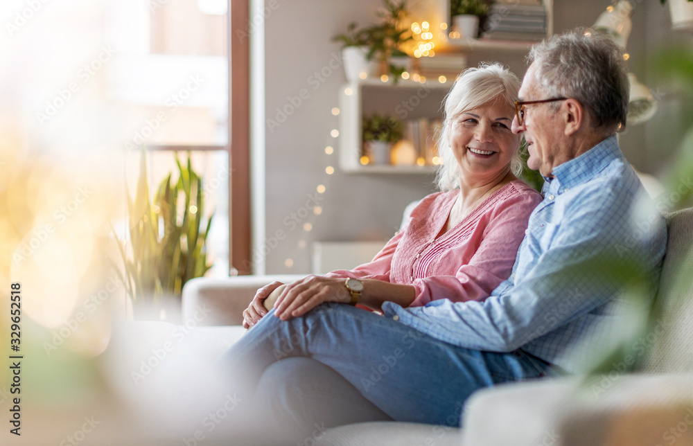 Portrait of a happy senior couple relaxing together at home Stock Photo ...