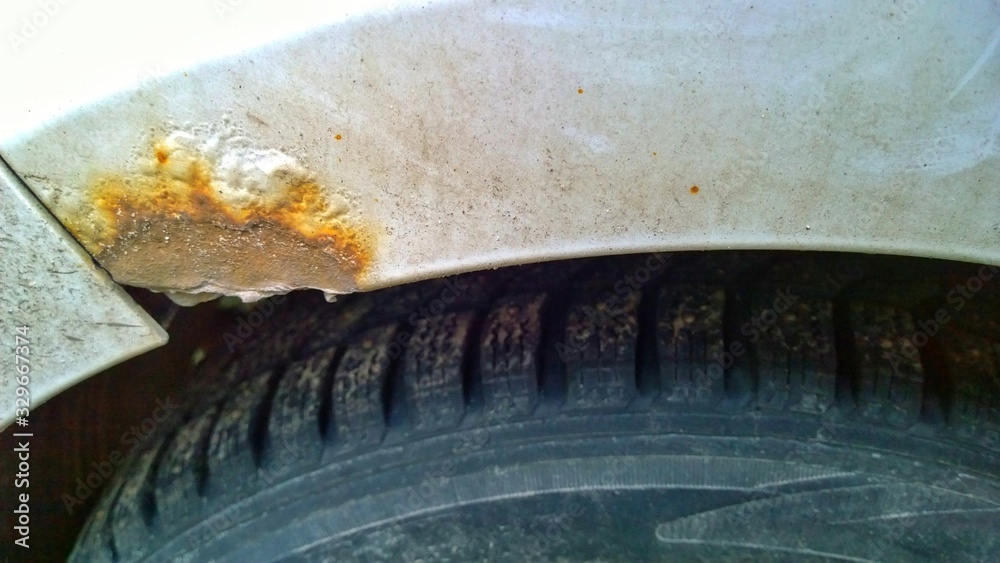Sheet metal corrosion of a dirty old car. Rusty surface, background ...