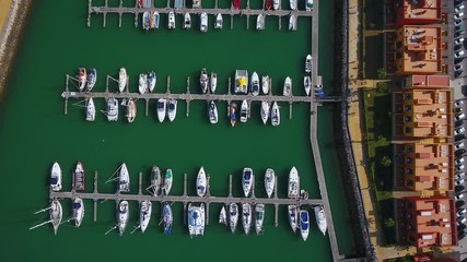 Wall Mural - Aerial. Aerial view of a Portuguese marina with yachts and motor boats, the city of Portimao.