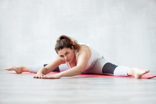 Lovely Woman Doing Stretching Or Yoga Exercise