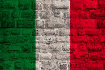 national flag of the modern state of Italy on an old historical stone wall, concept of business, tourism, travel, emigration, globalization