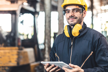 Industrial Engineers in Hard Hats.Work at the Heavy Industry Manufacturing Factory.industrial worker indoors in factory. man working in an industrial factory.