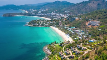 Wall Mural - Aerial hyperlapse of the coast of Phuket island in Thailand. Flight over the beaches of Kata Noi, Kata and Karon during the sunny day with clouds in the sky. Timelapse of the tropical island of Phuket