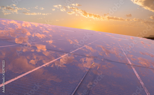 Fotografía clean energy concept, photovoltaic panels in the light of the rising sun