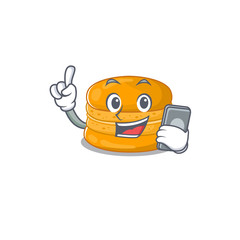 Sticker - Mascot design of orange macaron speaking on phone