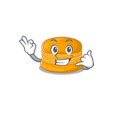 Sticker - Orange macaron mascot cartoon design showing Call me gesture