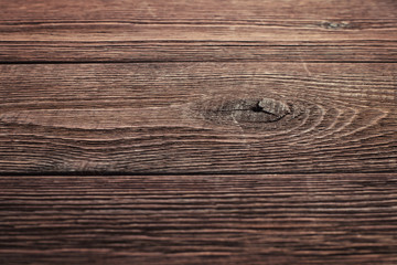 Wall Mural - Side view of the surface of an old rustic wooden table with shallow depth of field. Abstract trendy modern wood texture background