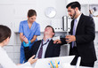 © JackF - Man receiving first aid  in office