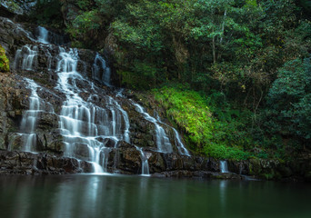 waterfall cover with green forest long exposure flat angle image