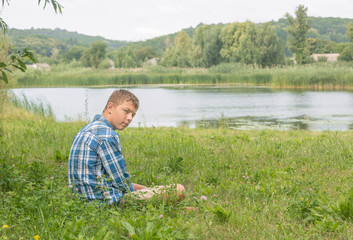 Sad thoughtful teenager sits alone