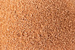 Make-up sponge close-up texture. Macro porous beige background