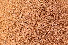 Make-up Sponge Close-up Texture. Macro Porous Beige Background