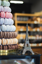 Eiffel Tower Miniature And Colored Macarons. France Souvenir