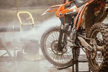 Cross-bike Washing After The Competition. Washing Dirty Wheel Of Motorcycle After The Race. Detail Of The Motocross Bike. Extreme Sport. 