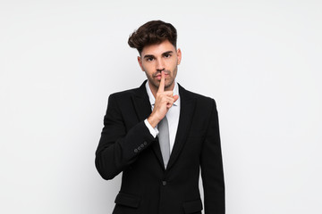 Young businessman over isolated white background doing silence gesture