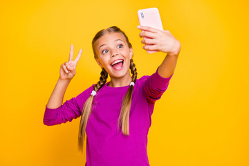 Poster - Close-up portrait of her she nice attractive lovely cute ecstatic cheerful cheery girl taking selfie showing v-sign isolated over bright vivid shine vibrant yellow color background