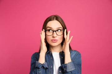 Wall Mural - Pensive woman on pink background. Thinking about answer for question