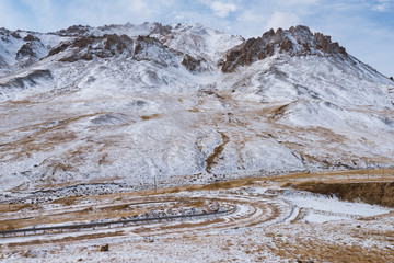 Wall Mural - the gravel road on the snow mountain